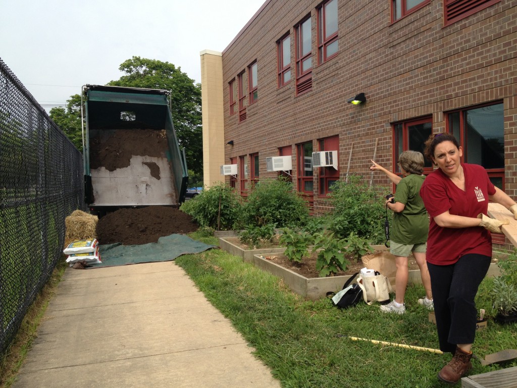 DELIVERY: Belle Mead Co-op dumped fresh garden soil atop a tarp for distribution by wheelbarrow to garden beds that needed topping off.