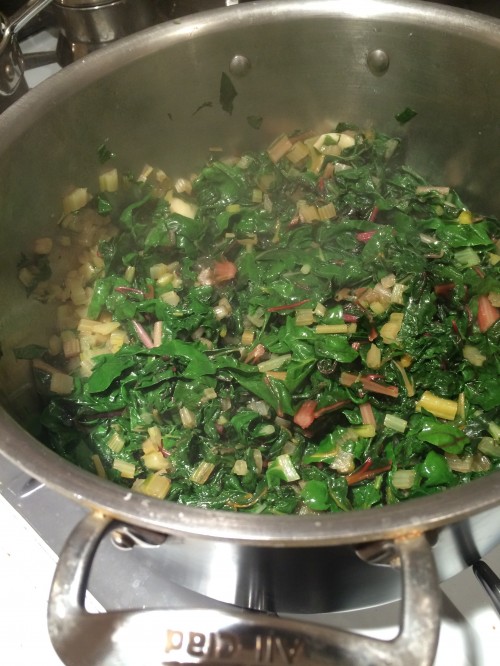 In the pan: Cut washed chard leaves into thin ribbons. Saute 1-2 peeled and crushed garlic cloves in olive oil until lightly golden. Add chard, salt and more olive oil if needed. When well wilted and fragrant, remove from heat and garnish with a squeeze of fresh lemon juice.