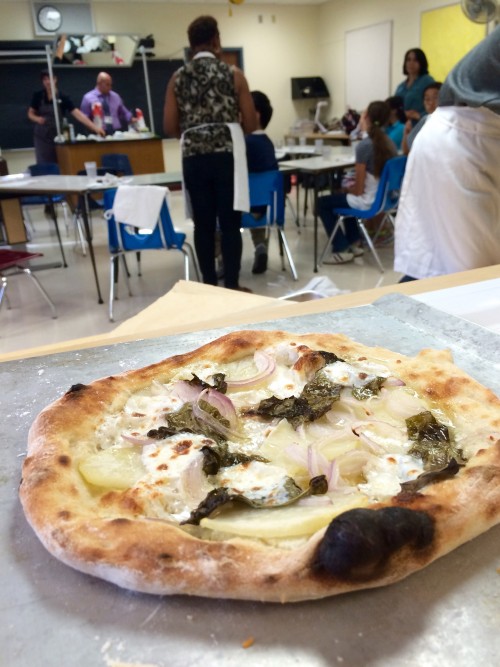 Potato, gorgonzola, sorrel and red onion pizza, fresh from the oven.