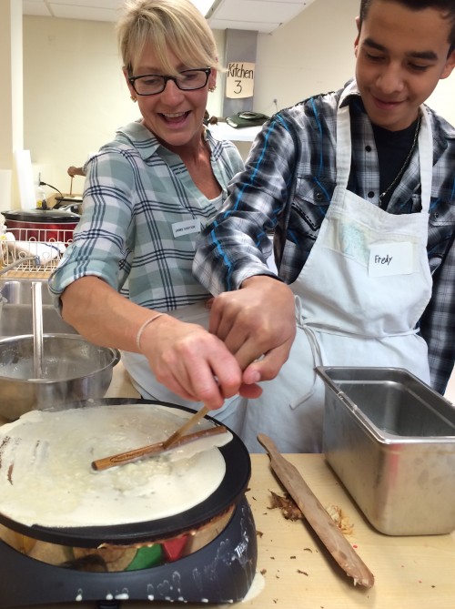 Crepe-making is an art that requires practice and a light touch with the trowel spreader.