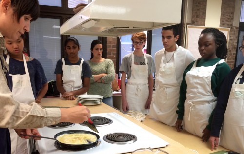 Chef Fuerst demonstrates a typical frittata technique before adding eggplant and caramelized onions as filling, and pounded herb sauce as a topping.