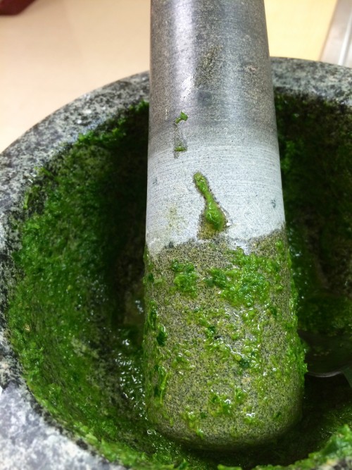 Use a mortar and pestle to make a fresh herb sauce with garlic, oil and lemon.