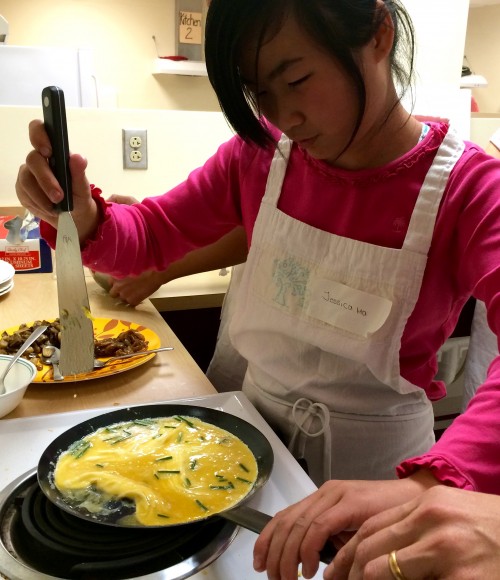 Begin with a good-quality pan. Add a knob of butter and, over medium heat, allow it to sizzle. Add egg mixture, sliding spatula beneath the cooked edges and tipping pan to allow uncooked mixture to flow beneath. 