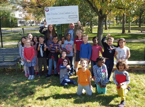 Kirsten Cluver, an associate chemist at Church & Dwight, Co., Inc., presented the Princeton School Gardens Cooperative an $8,000 check from the company's Employee Giving Fund. The funds will be distributed equally among the PTO boards of the four elementary schools to be used for edible garden education during the 2015-2016 school year. The Church & Dwight Employee Giving Fund is a workplace giving fund which was established in 2005 to meet the desires of employees to actively support and participate in the good works of not-for-profit organizations. For more information on the fund, click on the photo.