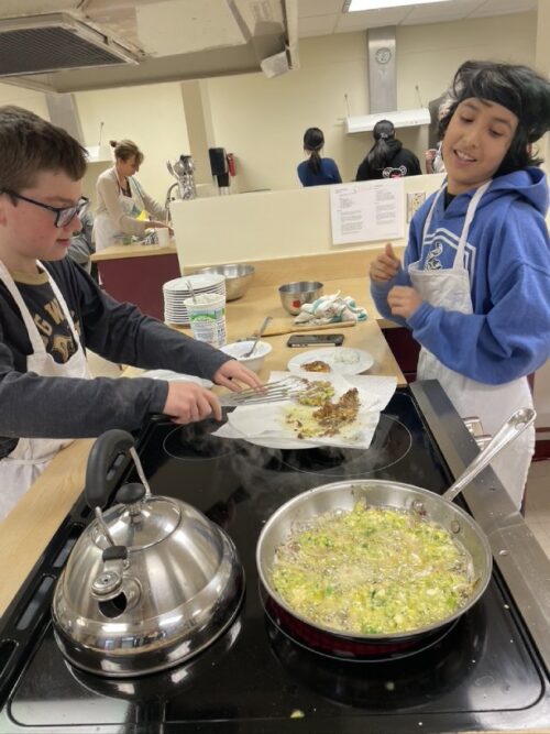 Students keeping an eye on the temperature for frying