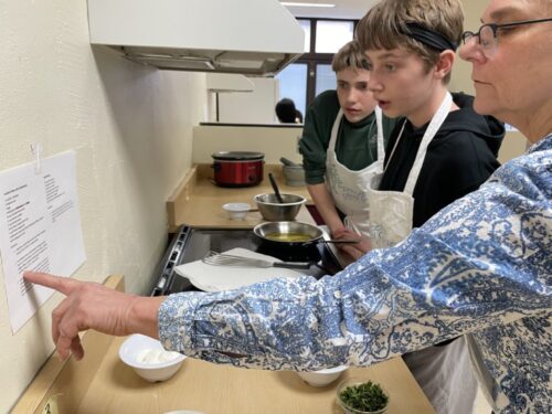 Staff and students checking the recipe