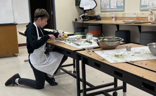 Student quickly prepping a few more herbs