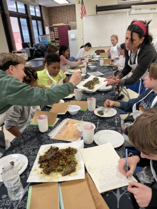 Students and staff dining and sharing