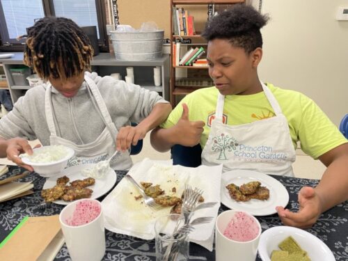 Student with thumbs up for eating green